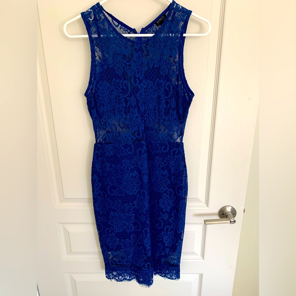 NBD cobalt blue lace dress . Lined with sheer stomach area. Worn once